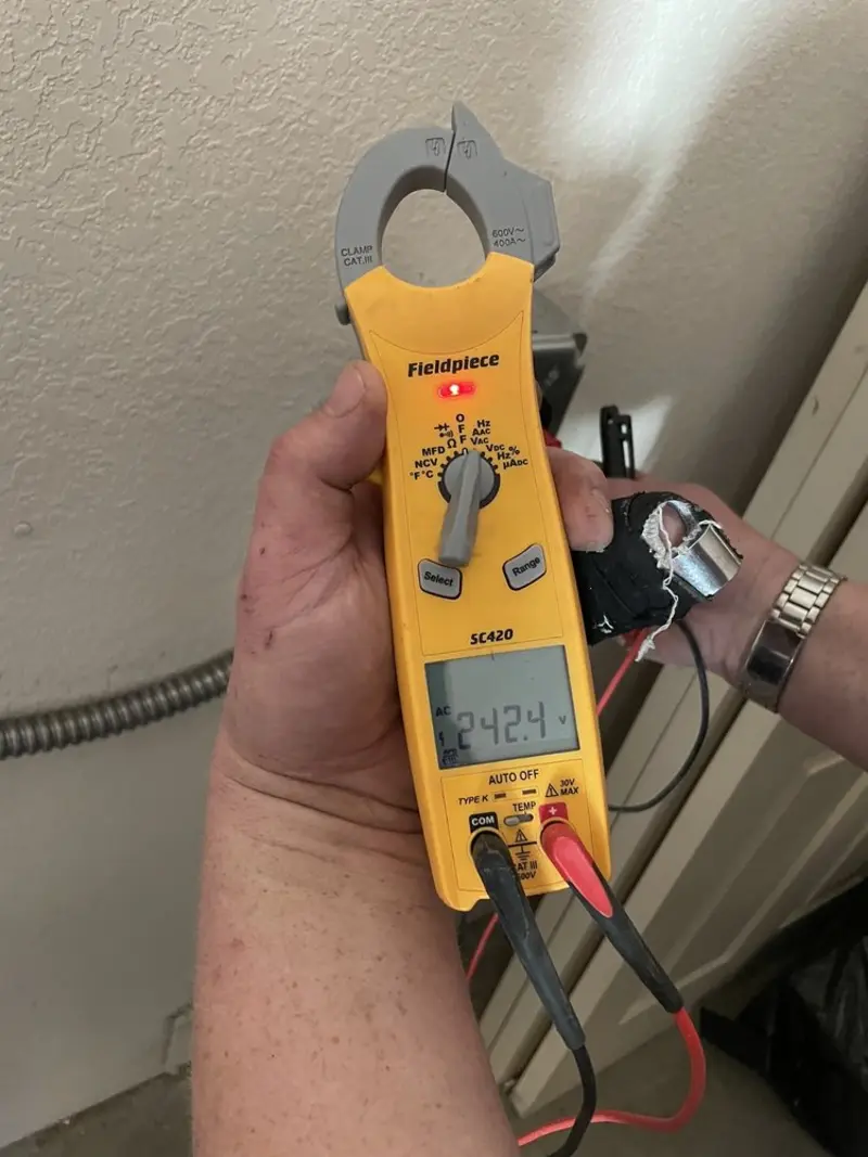 Voltage testing with clamp meter during Ceiling Fan Installation in Tonawanda